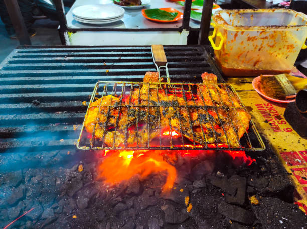 istock fresh fish being grilled to eat 2157142790