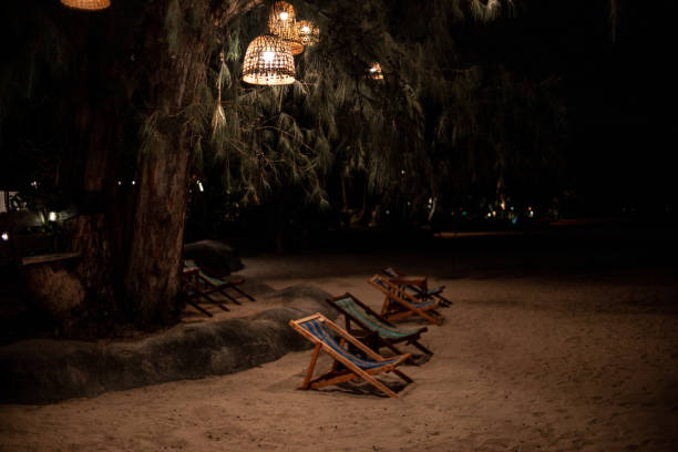 two sun beds on the beach . sand. night. rest and relaxation