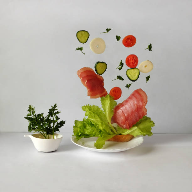 istock Sandwich in flight. Meat, tomatoes, cucumbers, lettuce are flying. 2157144589