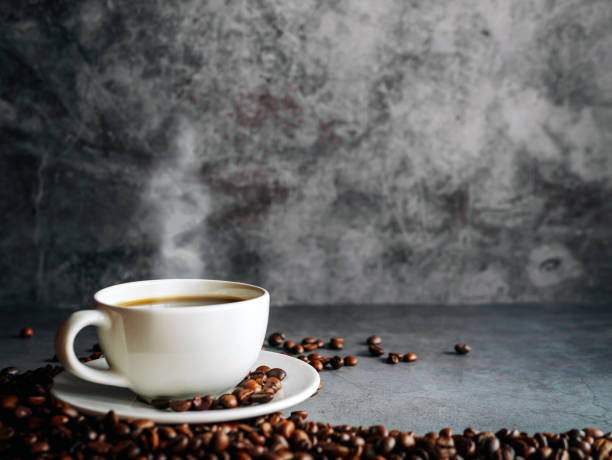 istock Coffee cup and coffee beans on  gray background, Black coffee cup aromatic 2157145973