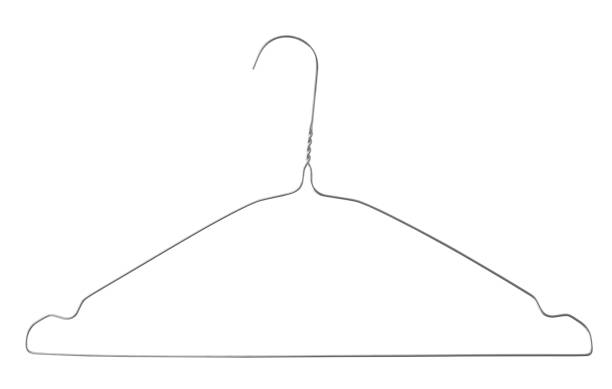 This close-up image focuses on the details of a clothing rack in a retail store. A row of light-colored wooden hangers hangs on a metal rail, with the primary focus on the white plastic size indicators attached to the chrome hooks. The central marker is sharply defined, displaying the letter \