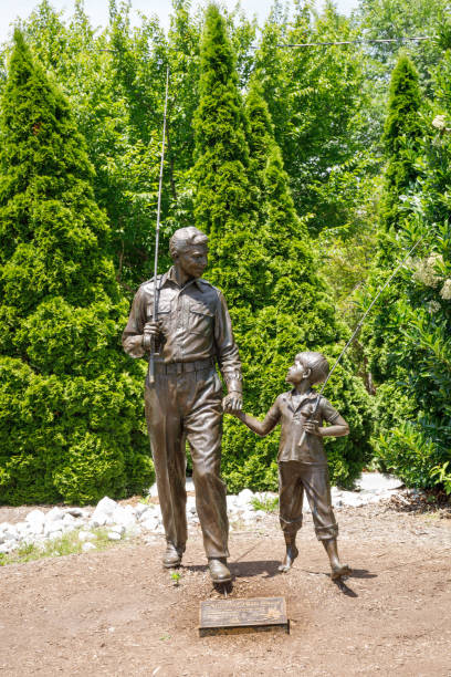 Mt. Airy, NC, USA-June 1, 2024: a Sculpture of the characters of Andy and Opie, father and son in the popular Andy Griffith show.
