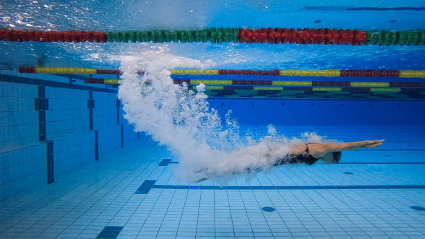 istock Water entry, immersion of three swimmers, underwater 2157148037