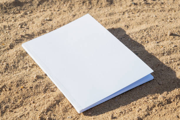 istock blank magazine mockup on sandy beach 2157151485