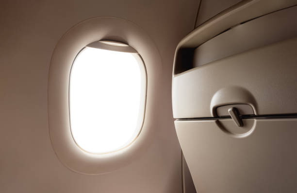 istock Airplane window from inside Passenger plane POV looking out , Isolated Windows Plane in back seat with clipping path 2157152847