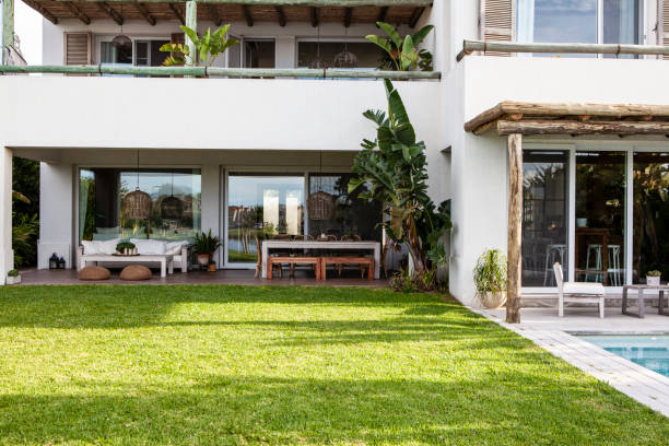 istock View of modern house with swimming pool and front lawn 2157153936