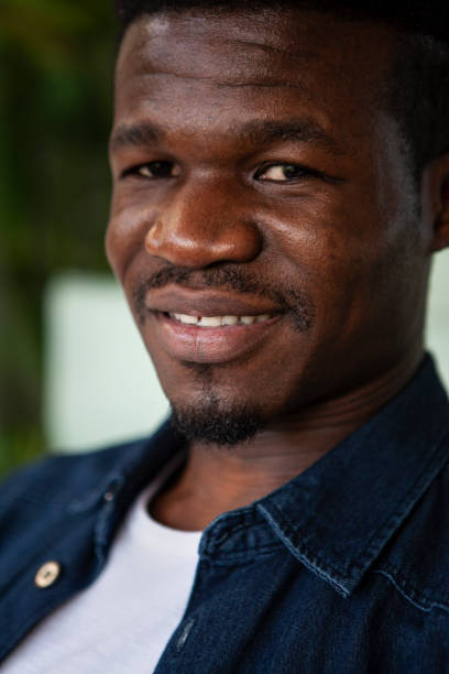 istock Front view portrait of young African American man looking at camera 2157154342