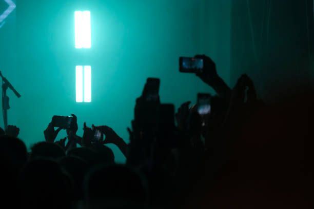 istock Concert Crowd Capturing Performance on Smartphones 2157159347