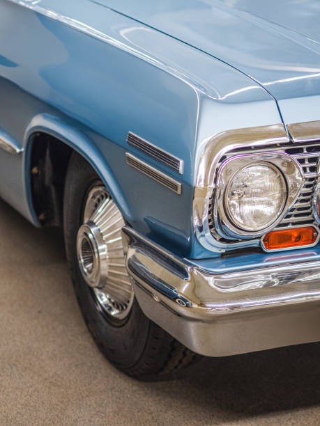 istock American blue retro car with front wheel and headlight. 2157164121