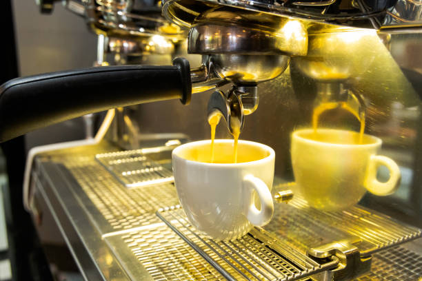 istock White cup with espresso from the coffee shop machine 2157164286