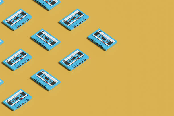 istock Isometric pattern of blue cassettes on yellow background. 3d illustration. 2157165146