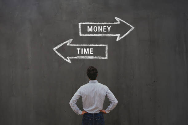 istock money vs time concept with arrows 2157165337