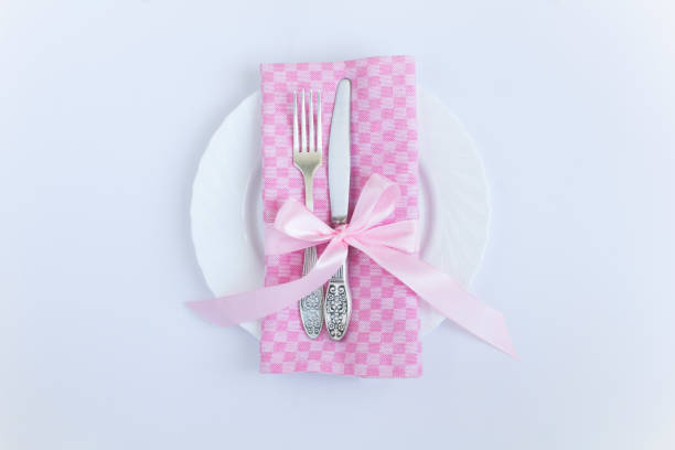 Banquet tables with cutlary ready for wedding reception.