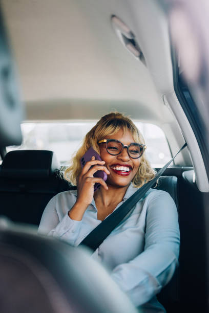 istock Woman Smiling While Talking On Phone In A Car 2157165835