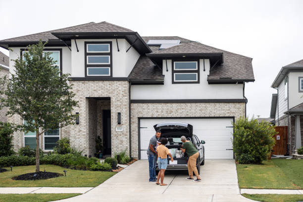 istock Multiethnic Family Charging EV with Solar Panels on Rooftop 2157166113