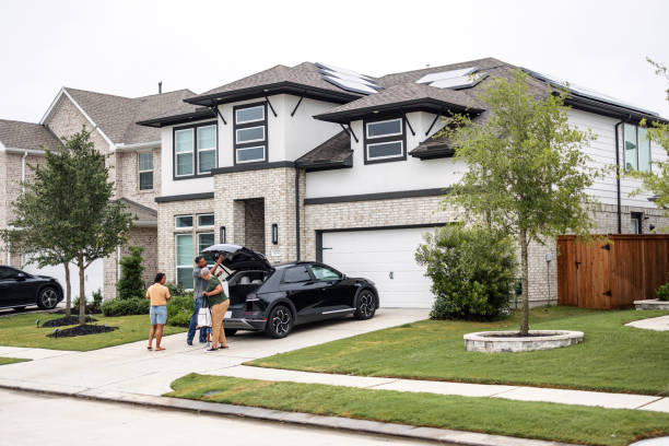 istock Multiethnic Family Charging EV at Home with Solar Panels 2157166124