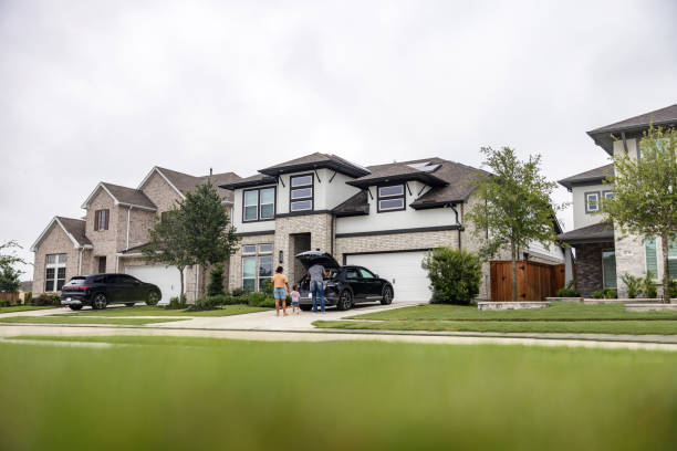 istock Multiethnic Family With EV and Solar Panels on Rooftop 2157166143