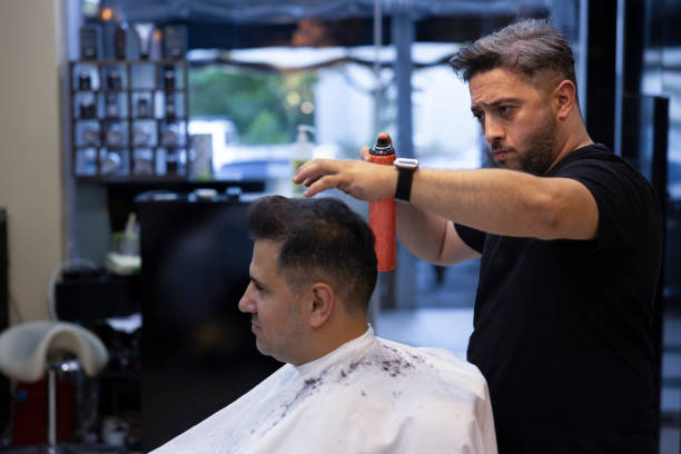 istock A man getting his hair cut at the barber 2157171617