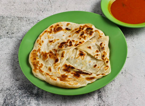 istock plain pratam porata or paratha with chilli sauce served in dish isolated on grey background side view of singapore food 2157172817