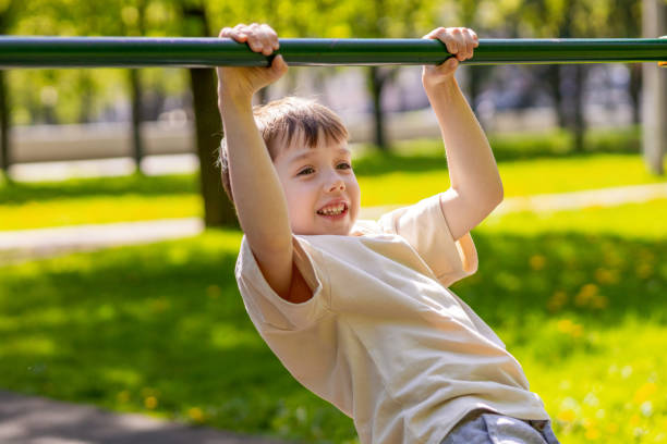 istock 6 year old boy doing sports training on the playground 2157176115