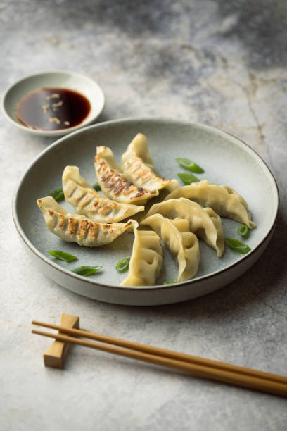 istock gyoza, japanese dumpling with soy sauce 2157178084