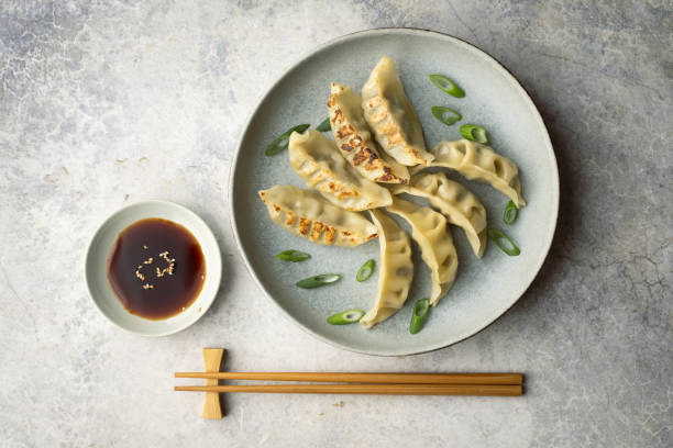 istock gyoza, japanese dumpling with soy sauce 2157178291