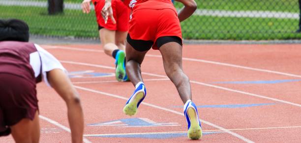 Long distance runners are running on the track