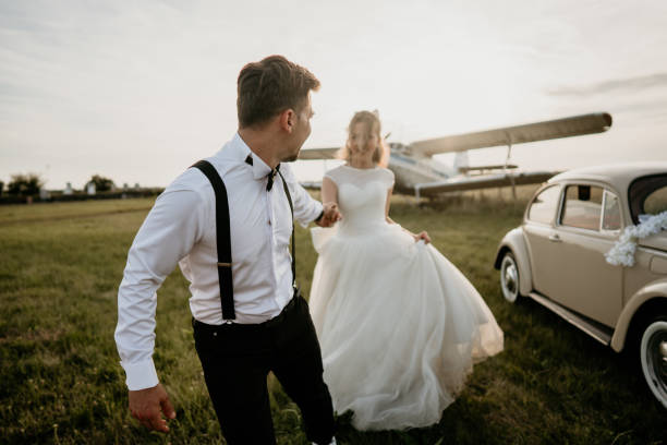 istock Pre-wedding shoot of a bride and groom  with old timer car 2157179328