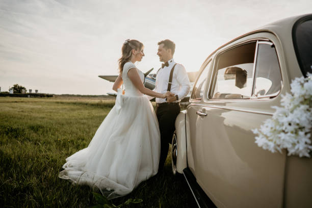 istock Pre-wedding shoot of a bride and groom  with old timer car 2157179331