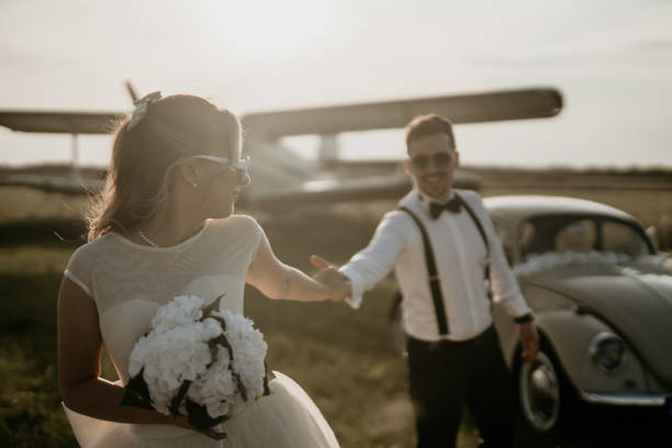 istock Pre-wedding shoot of a bride and groom  with old timer car 2157179948