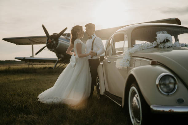 istock Pre-wedding shoot of a bride and groom  with old timer car 2157180046