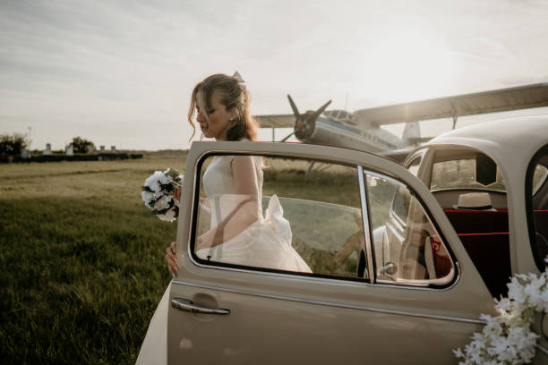 istock Pre-wedding shoot of a bride and groom  with old timer car 2157180069