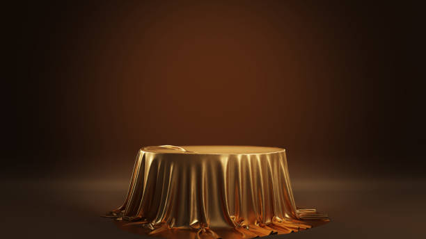 istock Empty podium covered with golden cloth. Abstract scene for product demonstration. 2157181264