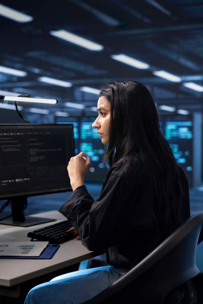 istock Worker checking for signs of imminent failure in data center establishment gear 2157181941