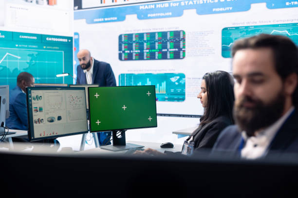 istock Businesswoman analyzing infographics next to green screen in headquarters 2157183222