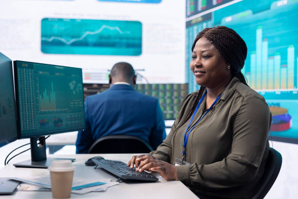 istock Chief executive officer reviews data shown on big display in the office 2157184574