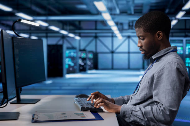 istock Employee checking for signs of tech failure in data center supercomputers 2157184601