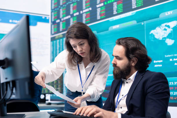 istock Company employees exchanging project details and big data 2157185447