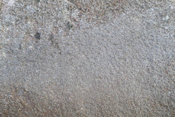 A textured stone with a rough surface ideal for backgrounds, overlays, and designs