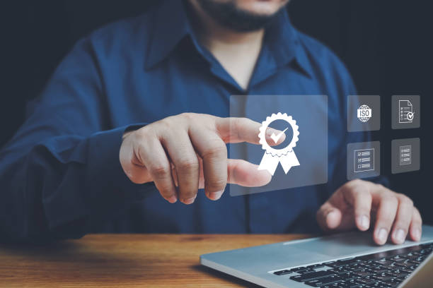 istock Quality ISO, ISO standards quality control, assurance and warranty business technology concept. Businessman using laptop computer with quality assurance and document icon for ISO, Standardization. 2157191376