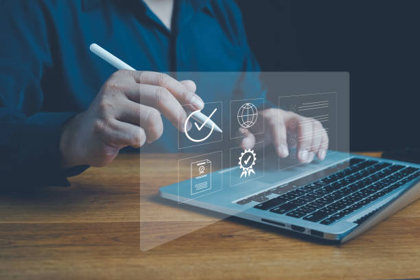 istock Quality ISO, ISO standards quality control, assurance and warranty business technology concept. Businessman using laptop computer with quality assurance and document icon for ISO, Standardization. 2157191388