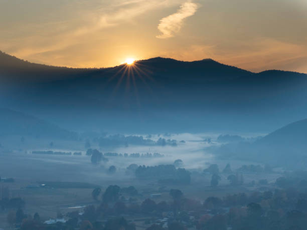 Sunrise over mountain ridge in the Ovens Valley Victoria
