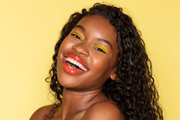 istock Happy black woman wearing yellow eye shadow 2157192499