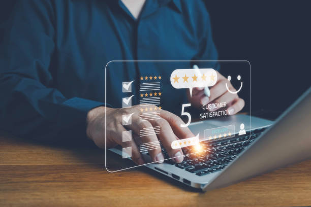istock Customer review satisfaction feedback survey. customer services best excellent business rating experience. Satisfaction survey . Hand of a businessman chooses a smile face icon. 5 Star Satisfaction. 2157194571