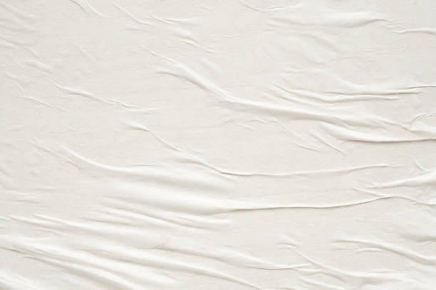 istock White blank crumpled and creased paper poster texture background 2157194635