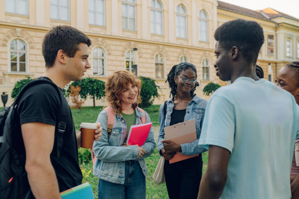 istock Diverse group of university students with textbooks at campus on a break 2157195206