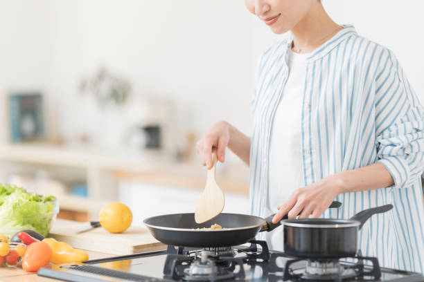 istock A woman cooking in the kitchen. 2157195306