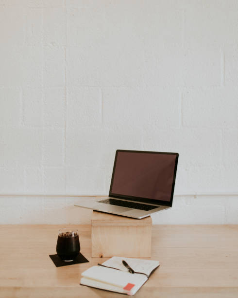 Laptop on a wooden table in a cafe