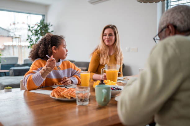 istock Diverse Family Enjoying Breakfast Together Indoors 2157197512