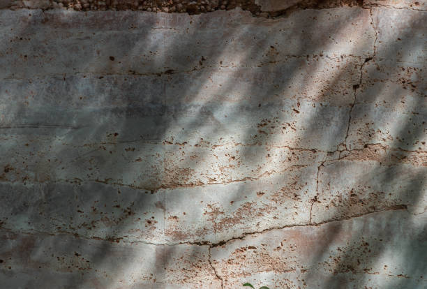 istock The sun is shining through the old brick cracked wall. 2157197698